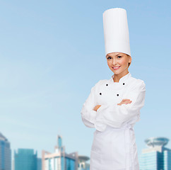 Image showing smiling female chef with crossed arms