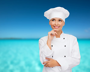 Image showing smiling female chef dreaming