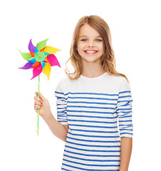 Image showing smiling child with colorful windmill toy