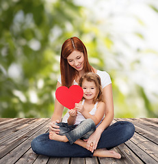 Image showing happy mother with adorable little girl and heart