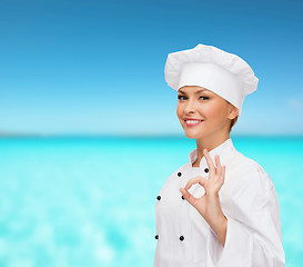 Image showing smiling female chef showing ok hand sign