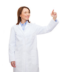 Image showing doctor pointing to something or pressing button