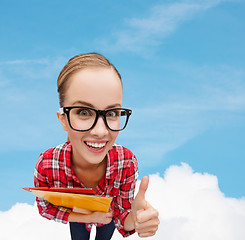Image showing student in glasses with folders showing thumbs up