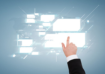 Image showing close up of businessman pointing to virtual screen