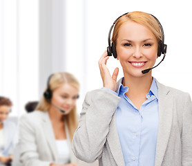 Image showing friendly female helpline operator at office