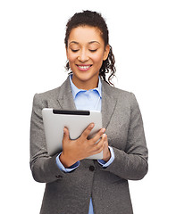 Image showing smiling woman looking at tablet pc