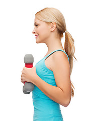 Image showing young sporty woman with light dumbbells