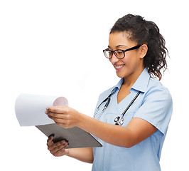 Image showing smiling female african american doctor or nurse