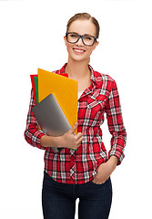 Image showing female in eyeglasses with folders and tablet pc