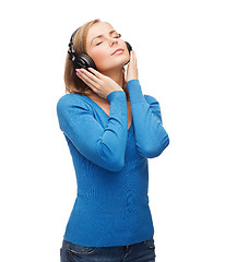 Image showing calm young woman with headphones