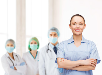 Image showing smiling female doctor or nurse