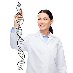 Image showing female doctor drawing dna molecule in the air