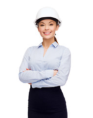 Image showing friendly smiling businesswoman in white helmet