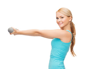 Image showing young sporty woman with light dumbbells