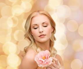 Image showing lovely woman with peony flower