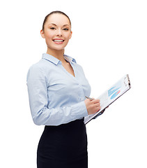 Image showing young smiling businesswoman with clipboard and pen