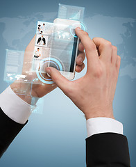 Image showing businessman touching screen of smartphone