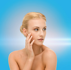 Image showing beautiful woman touching her face skin