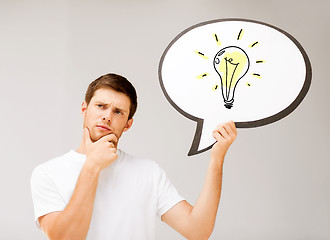 Image showing young man with light bulb in text bubble