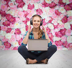 Image showing young woman in casual clothes sitting on floor