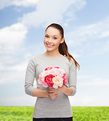 Image showing young woman with bouquet of flowers