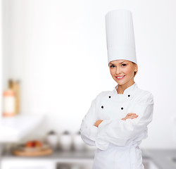 Image showing smiling female chef with crossed arms