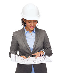 Image showing businesswoman in white helmet with blueprint