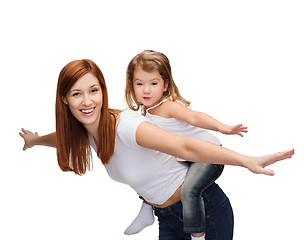 Image showing happy mother and child doing piggy back