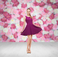 Image showing young woman in purple dress and high heels