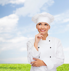 Image showing smiling female chef dreaming