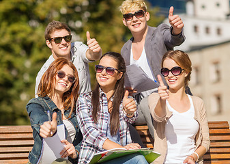 Image showing students with books, notebooks, files and folders