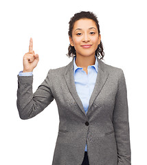 Image showing smiling businesswoman with her finger up