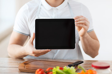 Image showing close up of male hands holding tablet pc