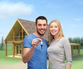 Image showing smiling couple holding keys