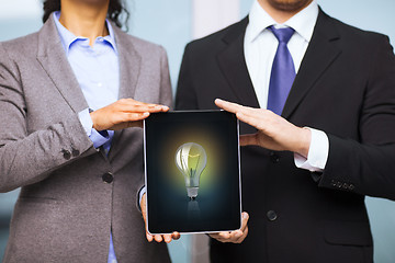 Image showing businessman and businesswoman with tablet pc