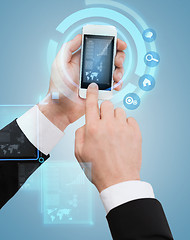 Image showing businessman touching screen of smartphone