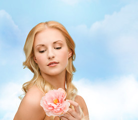 Image showing lovely woman with peony flower