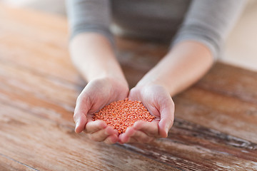 Image showing cloes up of female cupped hands with quinoa