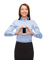 Image showing smiling businesswoman with smartphone blank screen