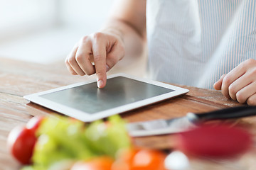 Image showing closeup of man pointing finger to tablet pc