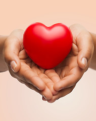 Image showing womans cupped hands showing red heart