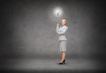 Image showing attractive young businesswoman with her finger up