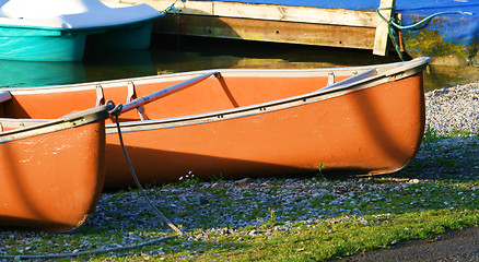 Image showing canoes in the morning light