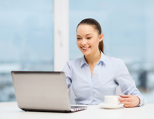 Image showing smiling businesswoman or student with laptop