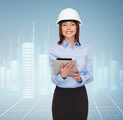 Image showing young smiling businesswoman in white helmet