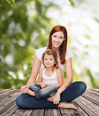 Image showing happy mother with adorable little girl