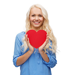 Image showing smiling woman with red heart