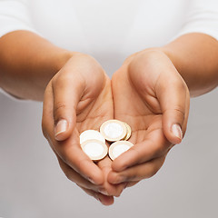 Image showing womans cupped hands showing euro coins