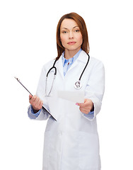 Image showing calm female doctor with clipboard