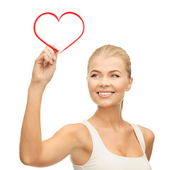 Image showing woman in white shirt writing in the air